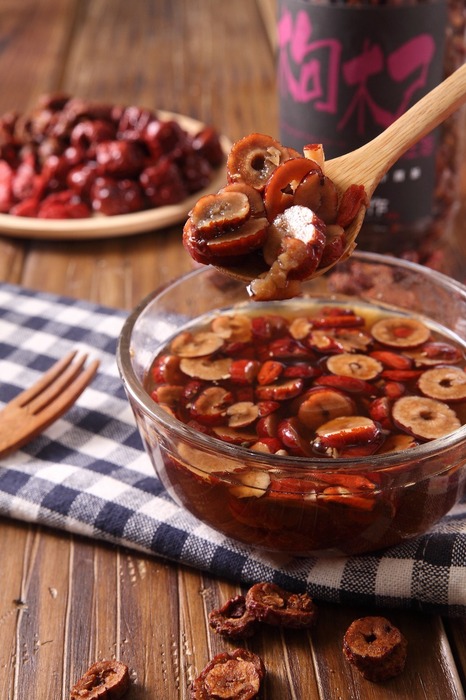 Warm Goji and Jujubes Tea in glass bowl