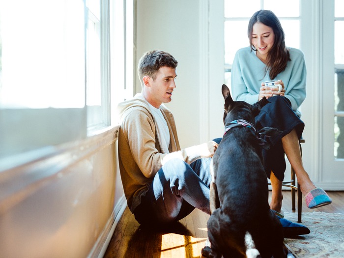 Hideaki Hamada's photography work: man, woman and dog next to bright window