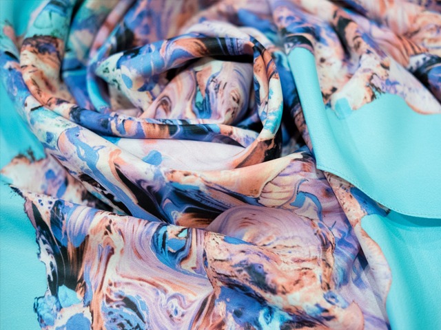 Monsoon marble scarf in abstract turquoise, blue, pink and violet colors.