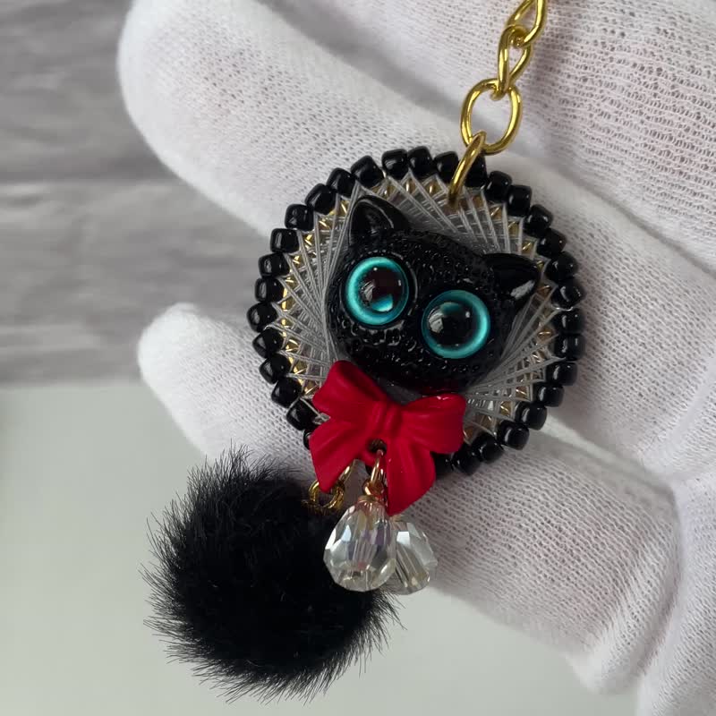 Enchanting blue-eyed black cat walking in the mysterious night sky and red ribbo - Keychains - Thread Black